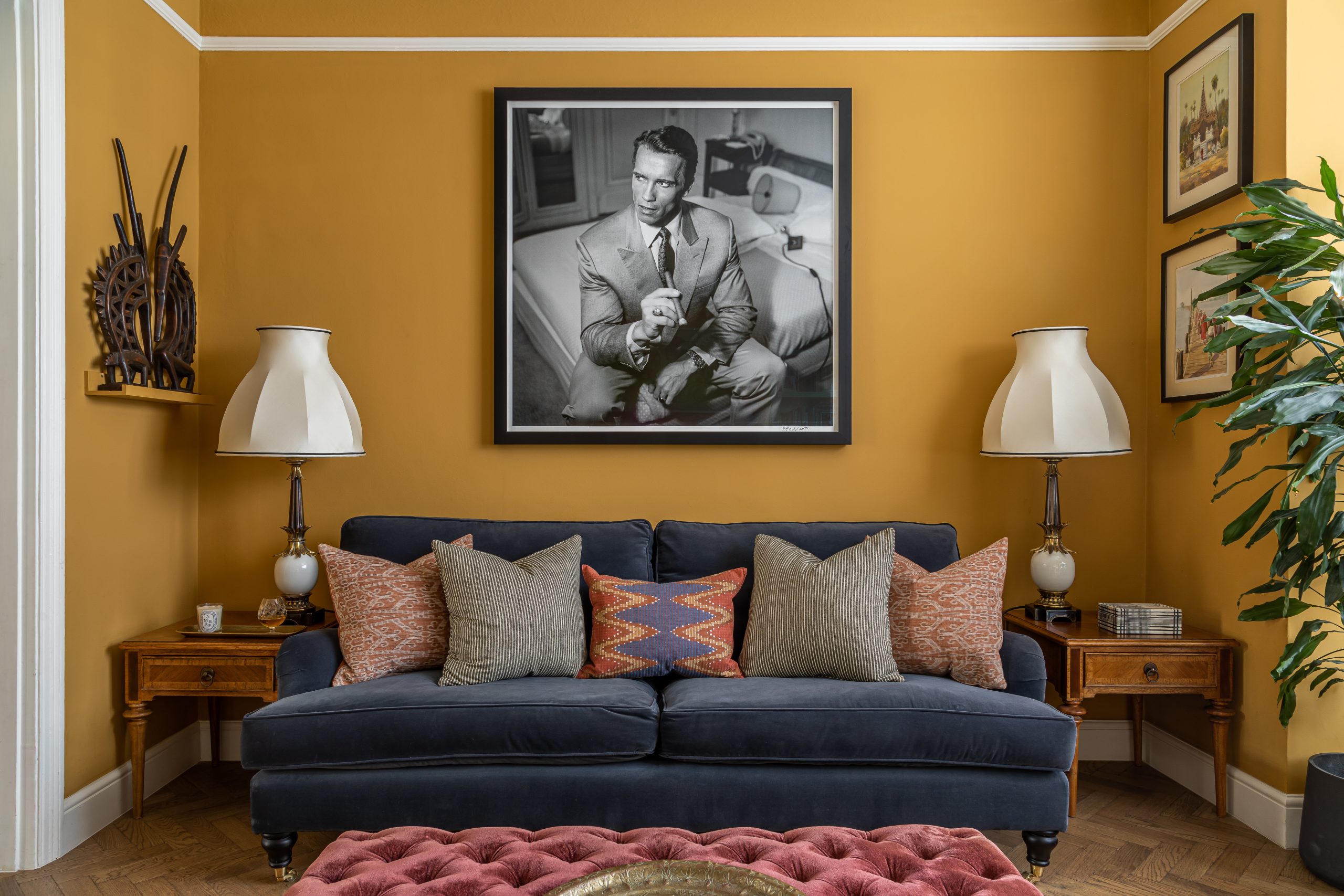 otta living room yellow walls blue sofa cushions