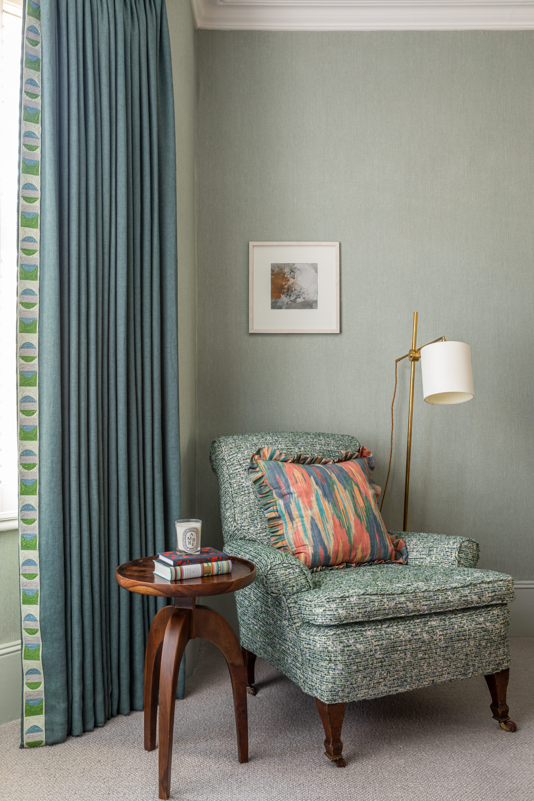 bedroom chair close up, curtain and trim, side table